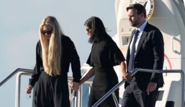 Vice President JD Vance, right, second lady Usha Vance, center, and Erika Kirk, holding a cross on a chain, deplane Air Force Two, carrying the body of Charlie Kirk, Thursday, Sept. 11, 2025, in Phoenix. (AP Photo/Ross D. Franklin)