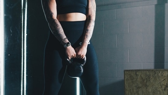 Fitness instructor Yasmin Karachiwala shared 3 exercises using kettlebells and medicine balls, that can help you shed those stubborn love handles.(Unsplash)
