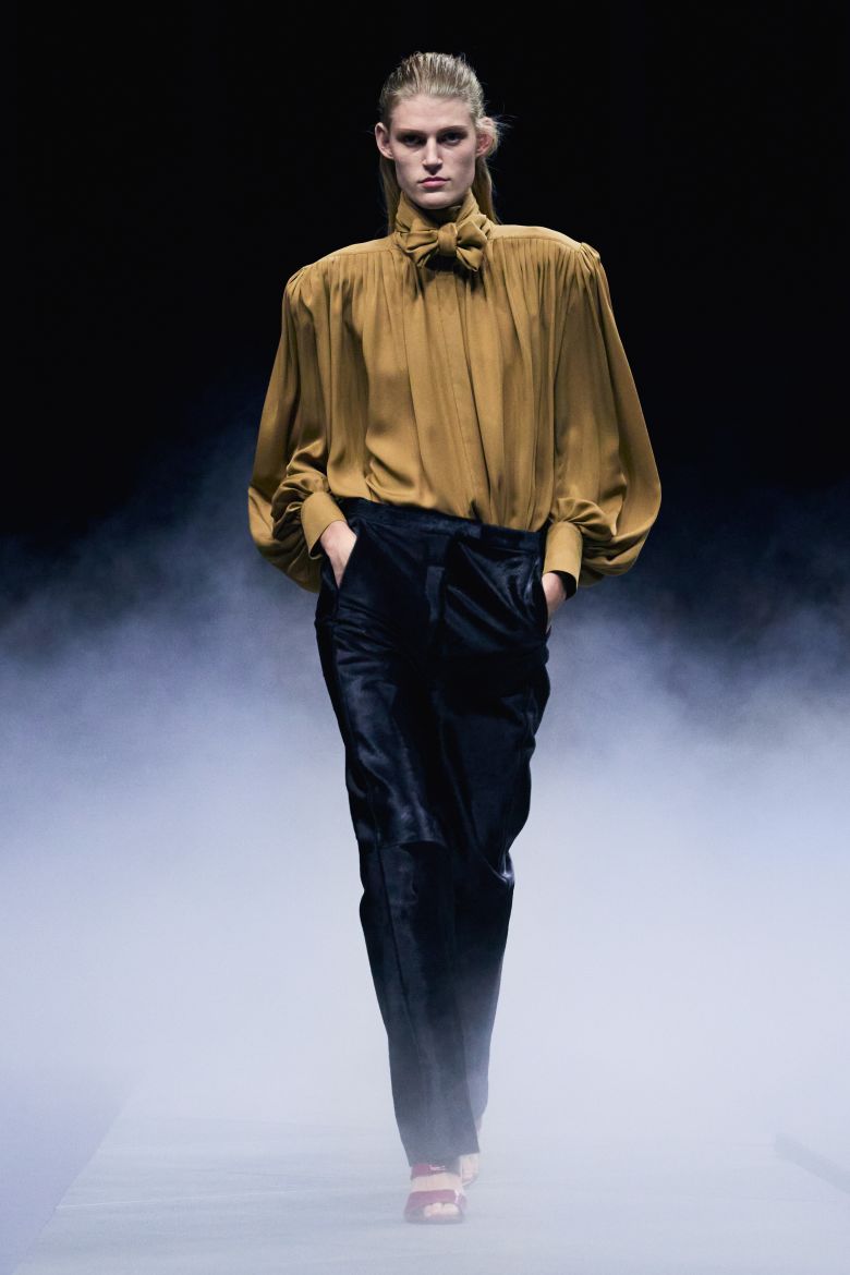The looks often balance exaggerated structure with a sense of flowing movement.