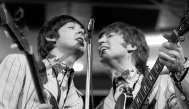 Paul McCartney and John Lennon performing