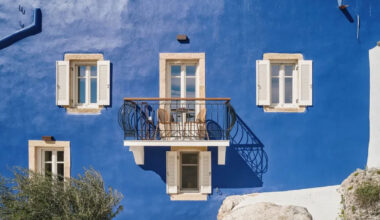 vibrant blue facade brings new life to the monk retreat in leros