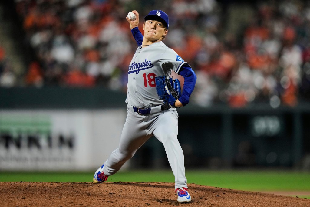 Los Angeles Dodgers pitcher throwing a baseball.