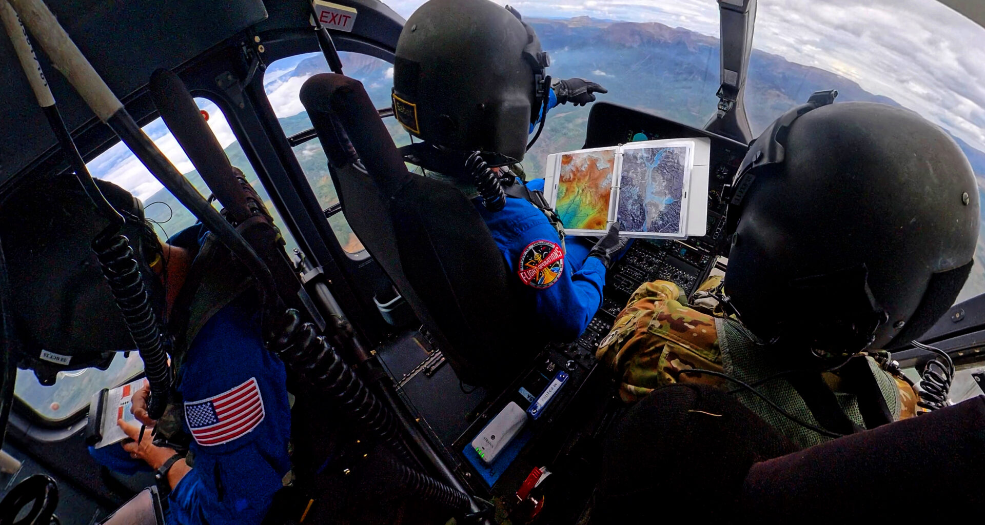 NASA astronauts Matthew Dominick (left) and Mark Vande Hei (right) prepare to fly out to a landing zone in the Rocky Mountains as part of the certification run for the NASA Artemis course at the High-Altitude Army National Guard Aviation Training Site in Gypsum, Colorado, Aug. 26.