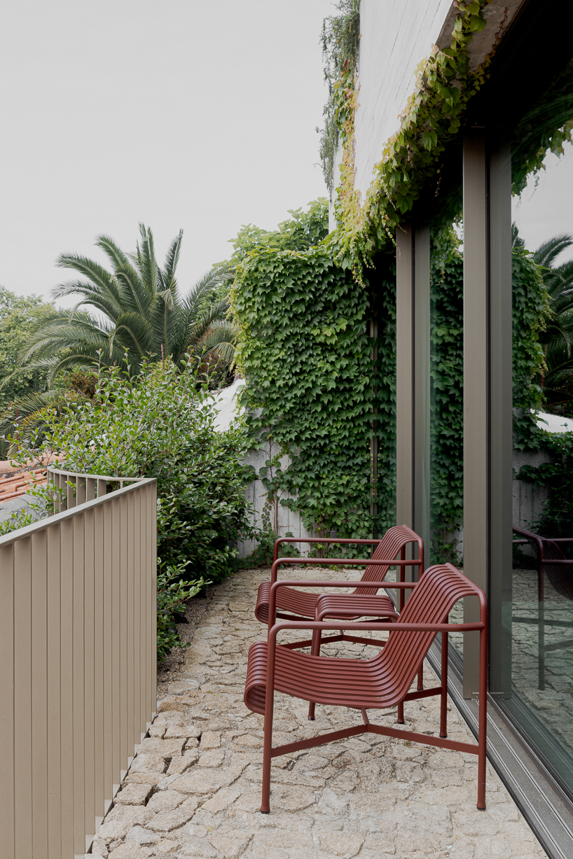 renovated porto residence reimagines hillside terraces with stepped concrete layers