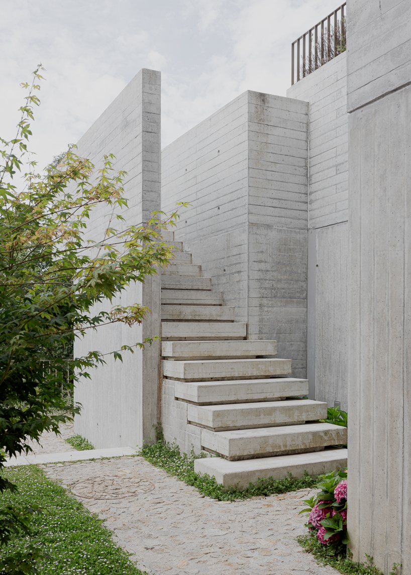 renovated porto residence reimagines hillside terraces with stepped concrete layers