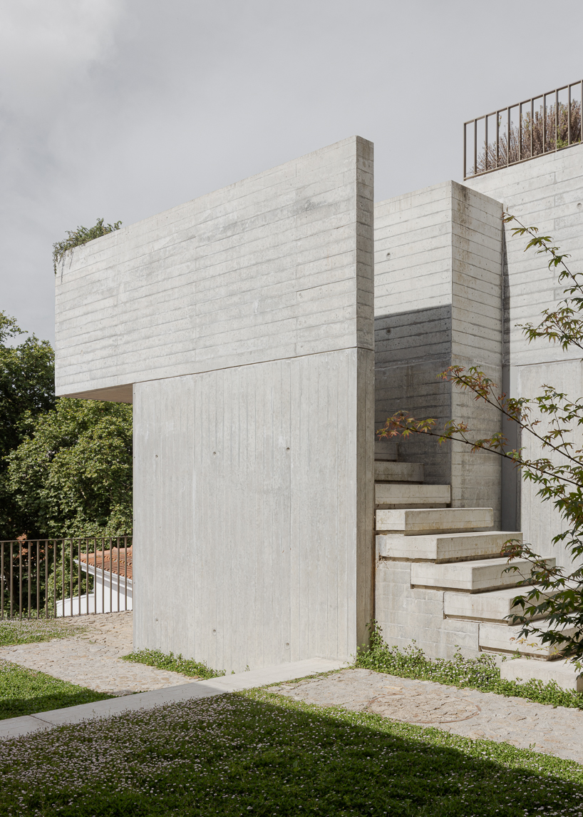 renovated porto residence reimagines hillside terraces with stepped concrete layers