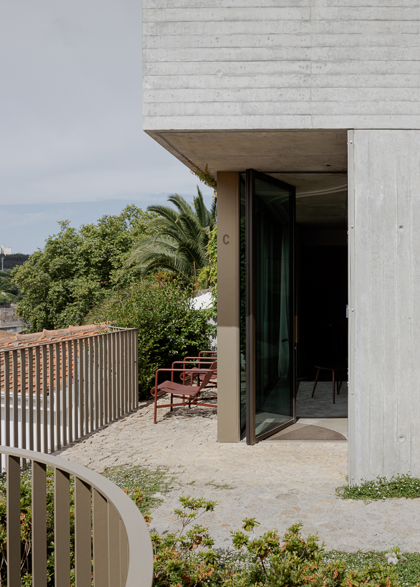 renovated porto residence reimagines hillside terraces with stepped concrete layers
