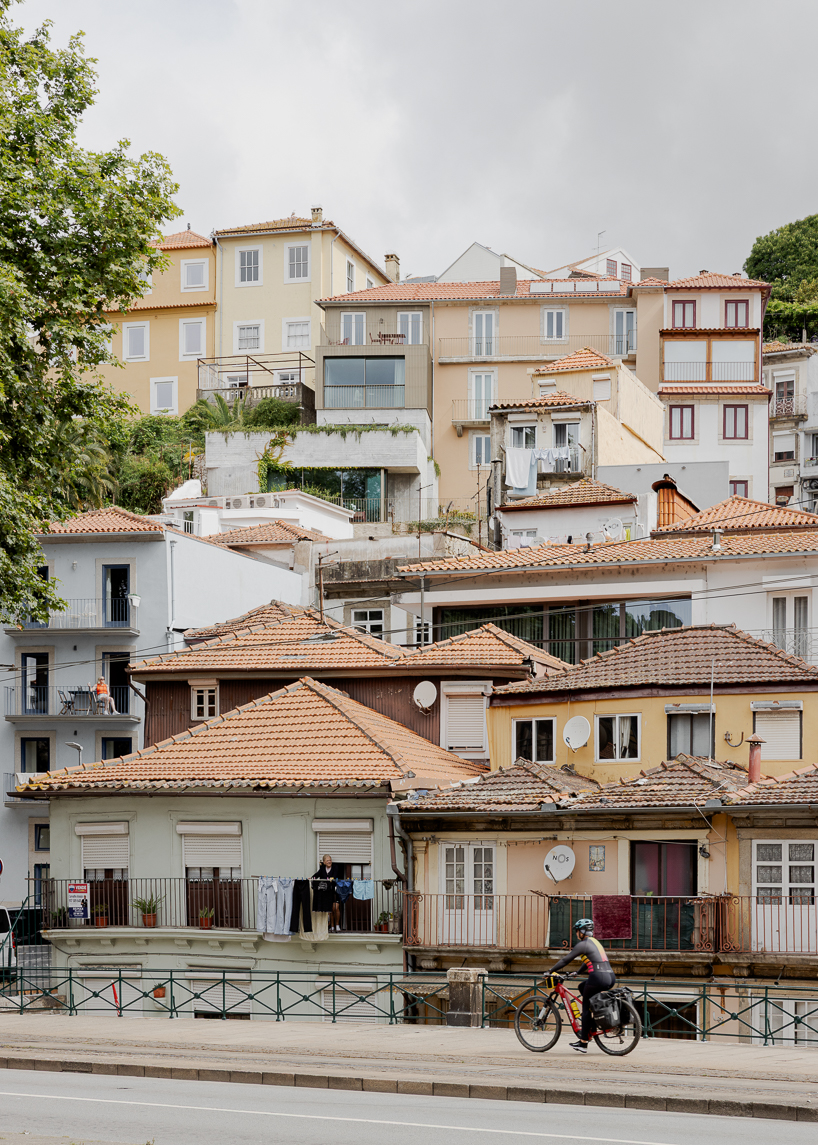 renovated porto residence reimagines hillside terraces with stepped concrete layers
