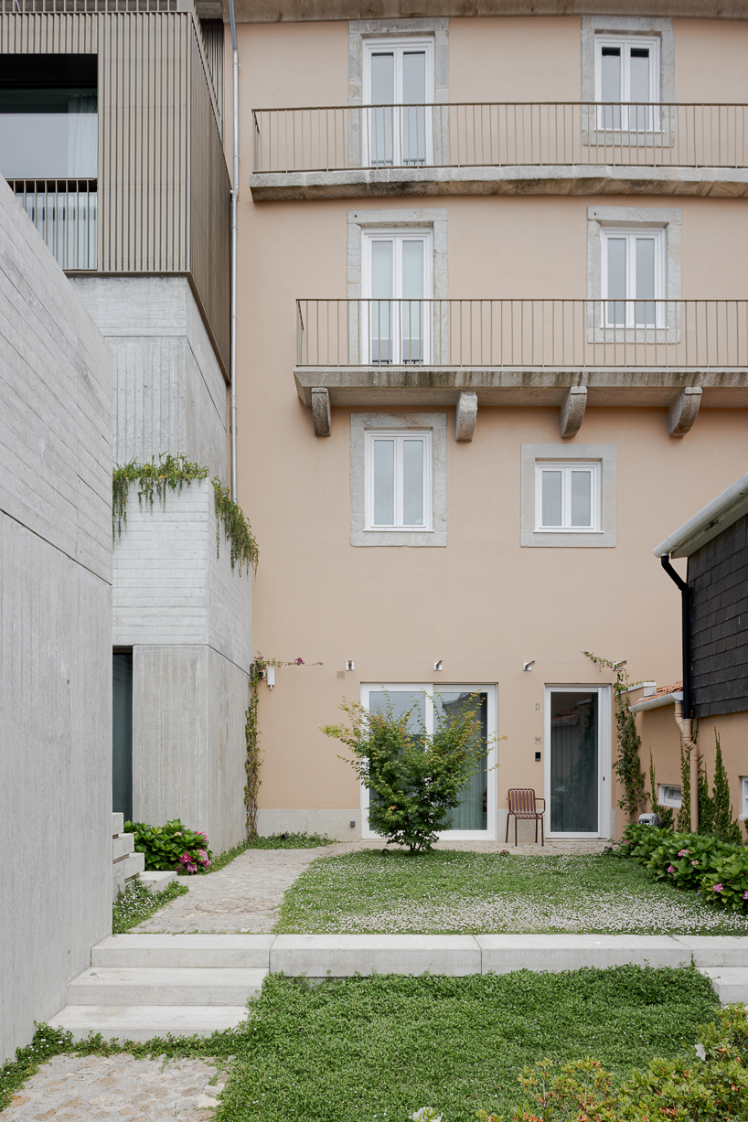renovated porto residence reimagines hillside terraces with stepped concrete layers