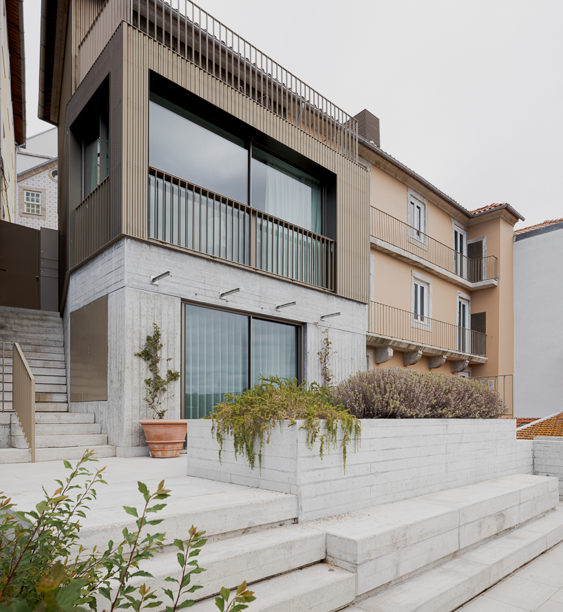 renovated porto residence reimagines hillside terraces with stepped concrete layers