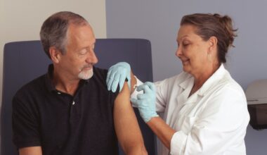 person receiving a vaccine from a health care professional. COVID-19 vaccine featured image