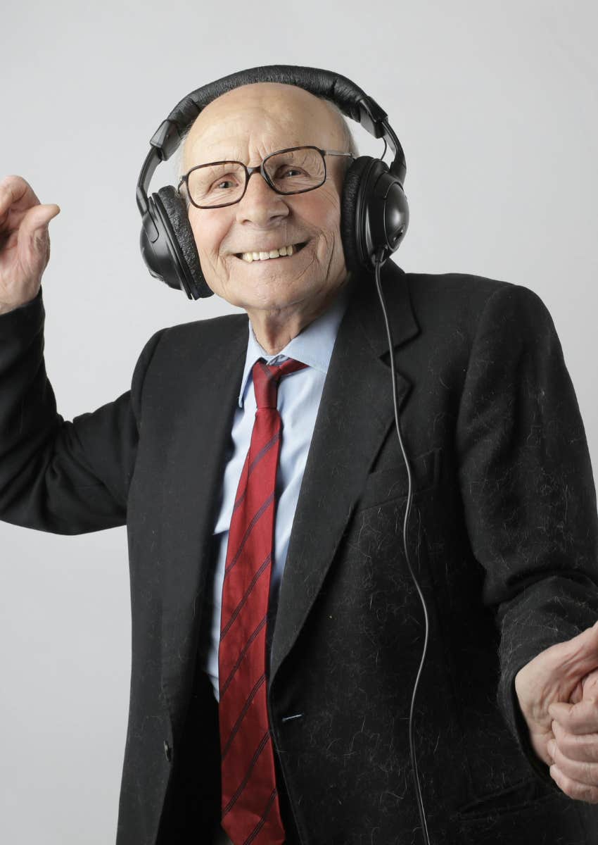 elderly man listening to music with headphones