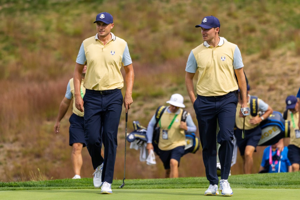 Ludvig Aberg and Rasmus Hojgaard walk the course during a Ryder Cup practice day.