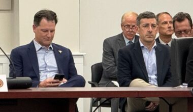Tampa Bay Rays co-presidents Brian Auld (left) and Matt Silverman (right) sit at a Pinellas County Board of County Commissioners meeting on Nov. 19, 2024. (Spectrum News/Josh Rojas)