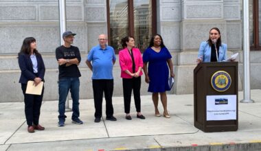 PennEnvironment deputy director Flora Cardoni (at podium) releases solar schools report at City Hall Wednesday.