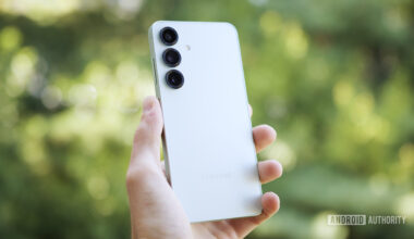 Someone holding the Samsung Galaxy S25, showing the back of the phone.