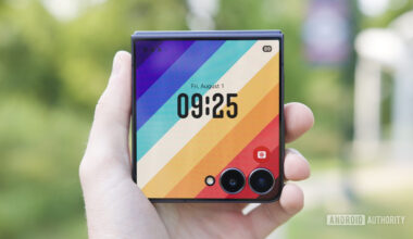 Holding the Galaxy Z Flip 7 with its cover screen on.