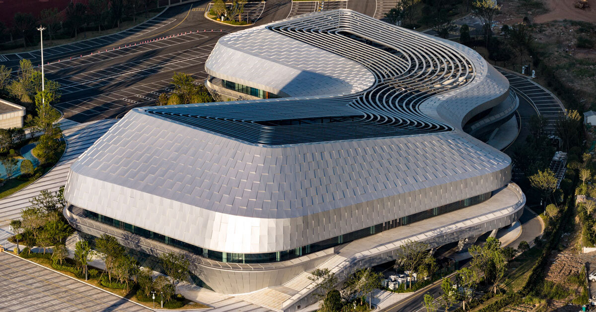 scale-like facade wraps hushan swimming center by LYCS architecture