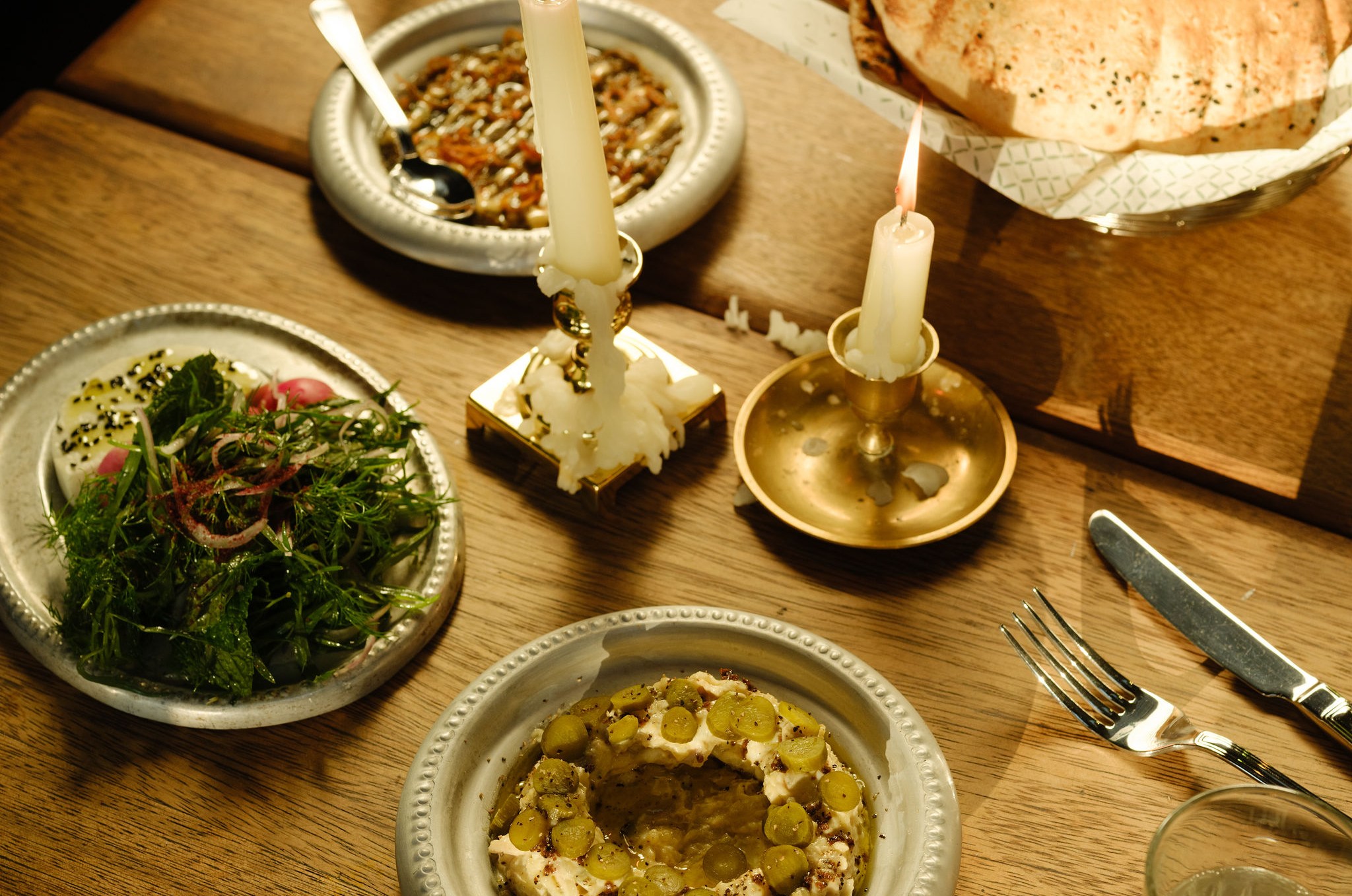 A moodily lit dining room table.
