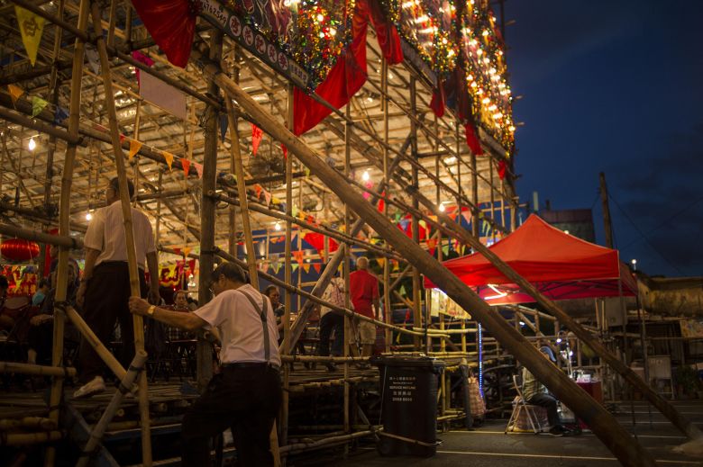 Attendees enter a bamboo theater on August 1, 2018. Cantonese opera is recognized by UNESCO as an intangible cultural heritage.