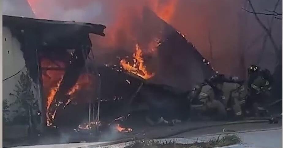 Chilling video captures moment a garage engulfed in flames collapsed on a Fort Worth firefighter, trapping him inside