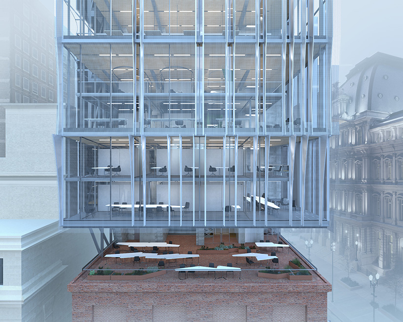 perforated metal panels clad office floating above st. louis's century-old columbia building