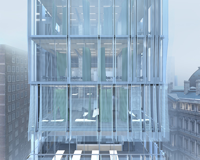 perforated metal panels clad office floating above st. louis's century-old columbia building