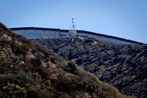 A Border Patrol agent along the U.S.-Mexico border on Sept. 3 in San Diego. (Ana Ramirez / The San Diego Union-Tribune)