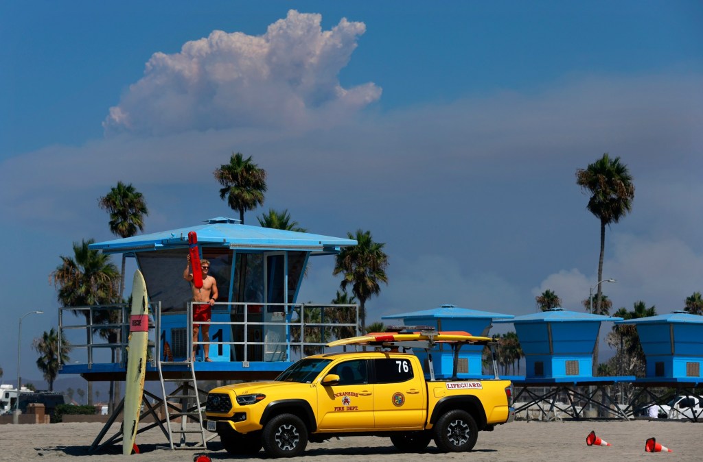 Two rescued after being swept off Oceanside jetty by wave