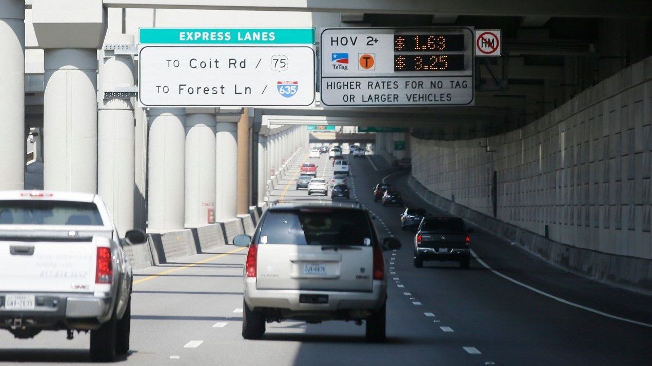 A sign tells drivers of the rate to drive on a toll road in Dallas, Thursday, Aug. 10, 2017. (AP Photo/LM Otero)