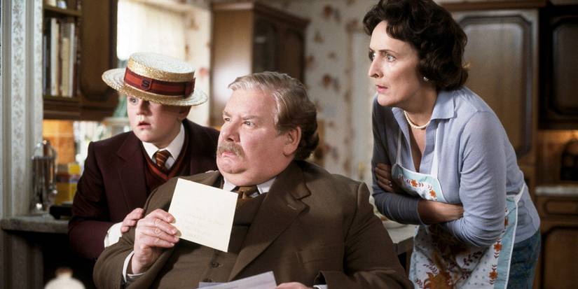 The Dursley Family holding Harry's letter from Hogwarts in Harry Potter and the Sorcerer's Stone 2001