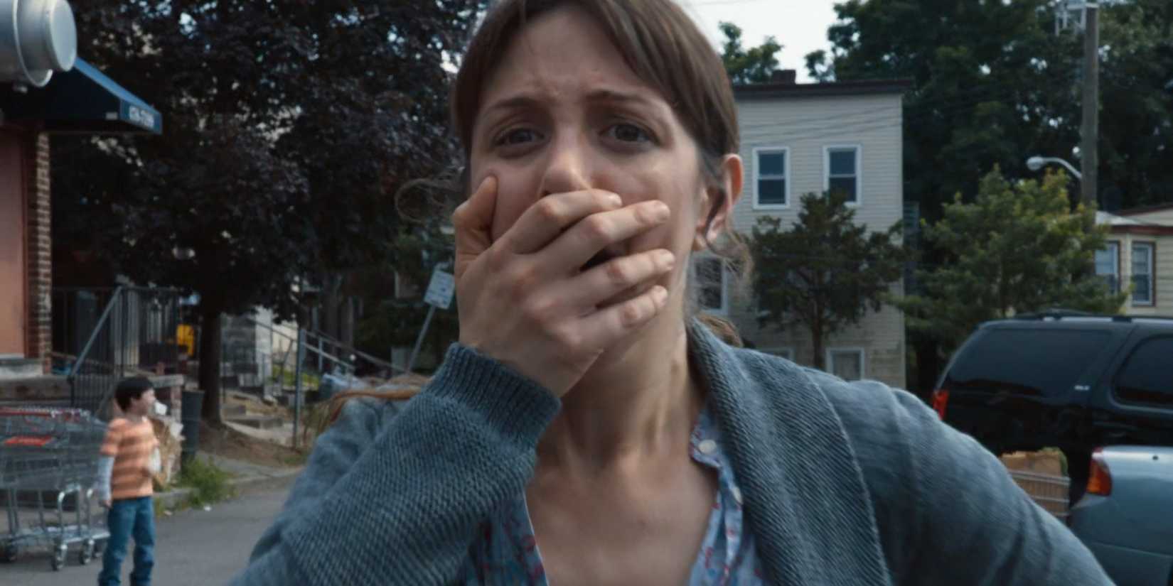 A mother gasping in horror in the opening scene of The Leftovers