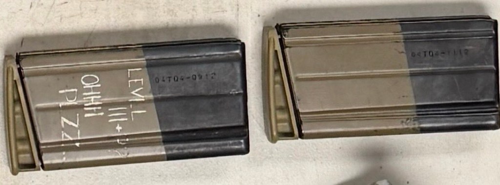 Two marked magazines, one with the inscription "OHHH PLZZZ LEVEL", found in a vehicle belonging to an individual arrested for drunk driving.