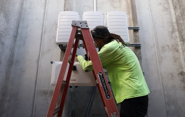 Darius Lauture foreman for 15 years installs components for solar energy at the City of Orlando's fleet and facilities buildings, as part of a larger effort to power all city buildings with solar by 2030, on Friday, Sept. 5, 2025. (Ricardo Ramirez Buxeda/Orlando Sentinel)