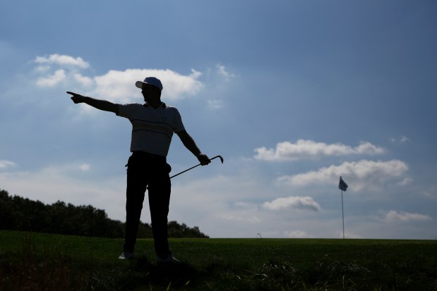 Europe's Justin Rose points at a loud fan during Ryder Cup play on the Bethpage Black golf course in New York.(AP Photo/Matt Slocum)
