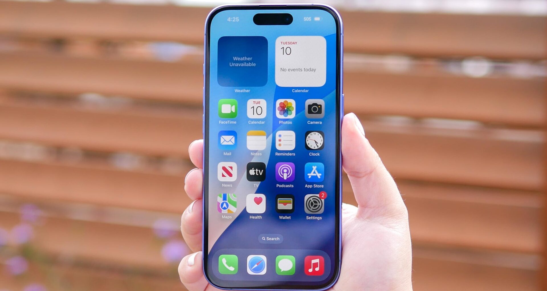 Apple iPhone 16 held in the hand.