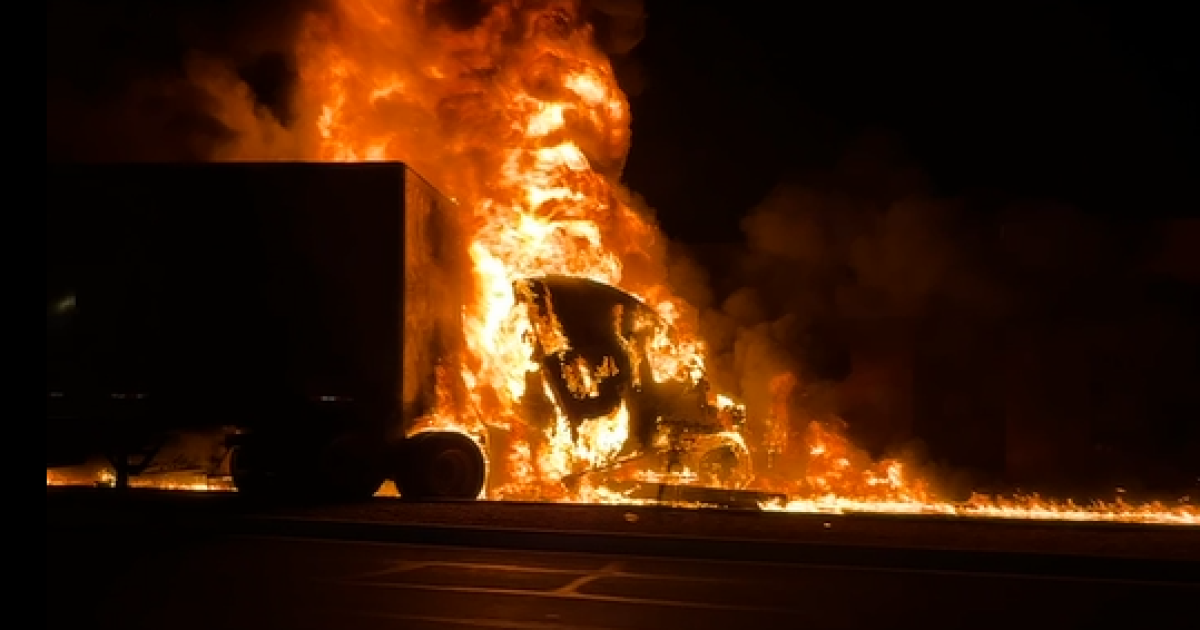 Police investigating fiery crash between tractor-trailer and light rail train