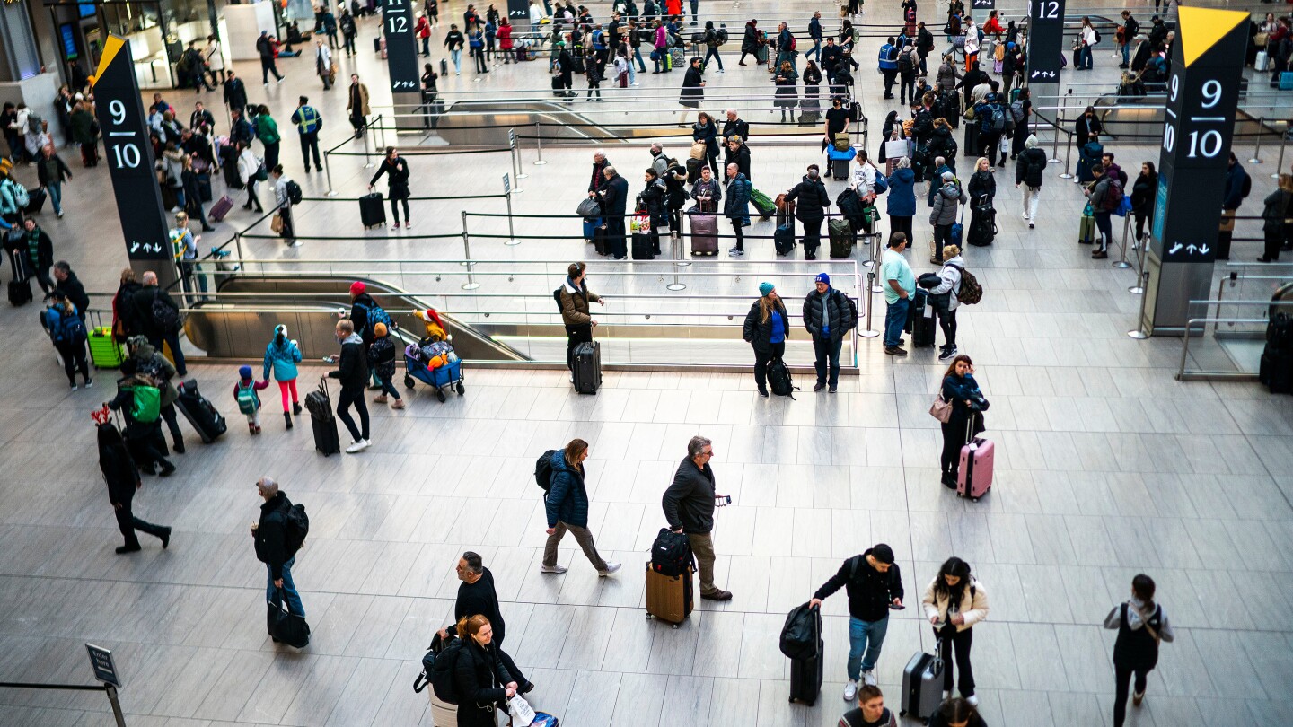 Off-duty officer shoots and wounds man inside New York City's busy Penn Station, police say