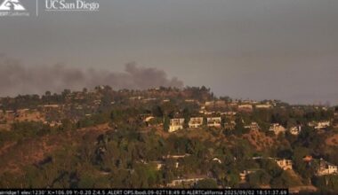 Brush fire burns in the Hollywood Hills, threatening homes