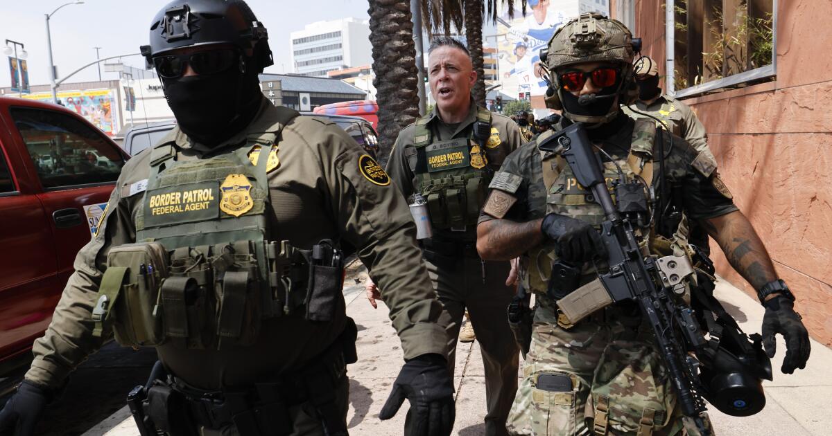Commentary: Against the backdrop of the Hollywood sign, the Border Patrol takes a hellaweird group photo