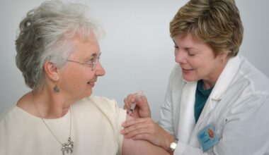 A woman receives a vaccine from a health care professional. RSV vaccine featured img