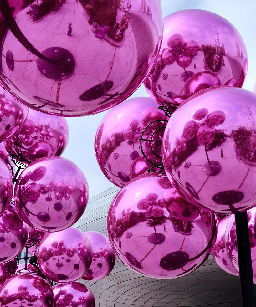 vincent leroy's kinetic cloud sculpture of glossy pink spheres hovers at seoul's design plaza