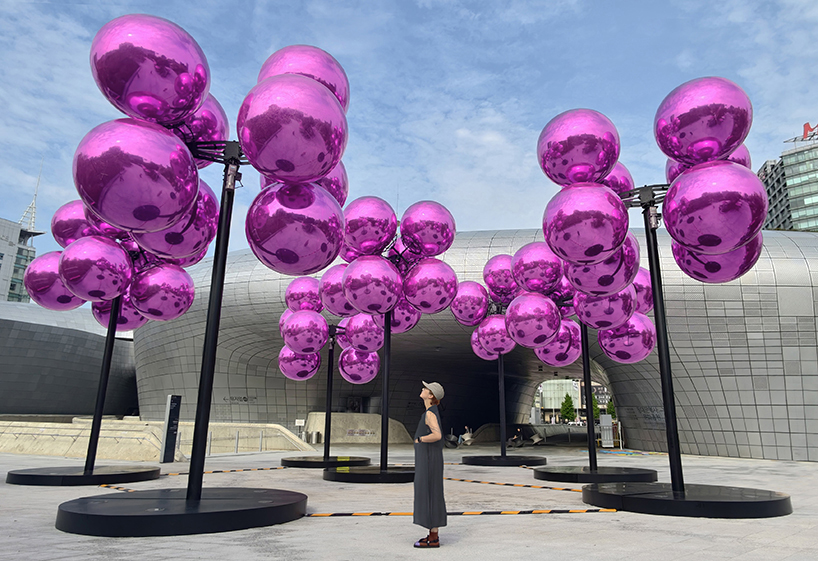 vincent leroy's kinetic cloud sculpture of glossy pink spheres hovers at seoul's design plaza