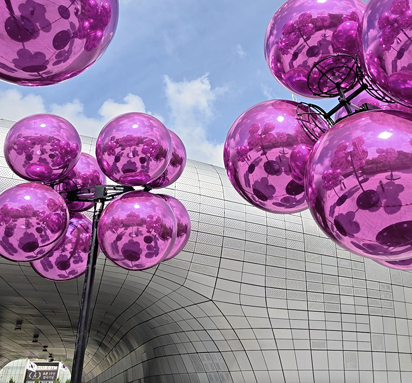 vincent leroy's kinetic cloud sculpture of glossy pink spheres hovers at seoul's design plaza