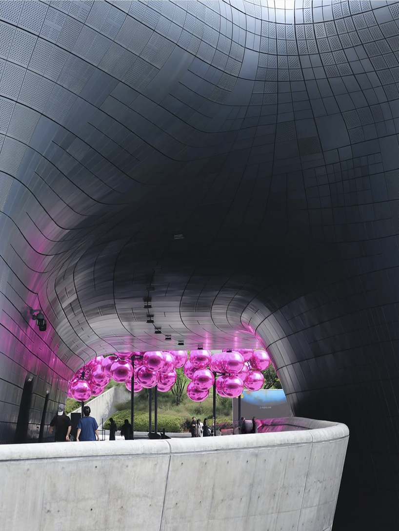 vincent leroy's kinetic cloud sculpture of glossy pink spheres hovers at seoul's design plaza