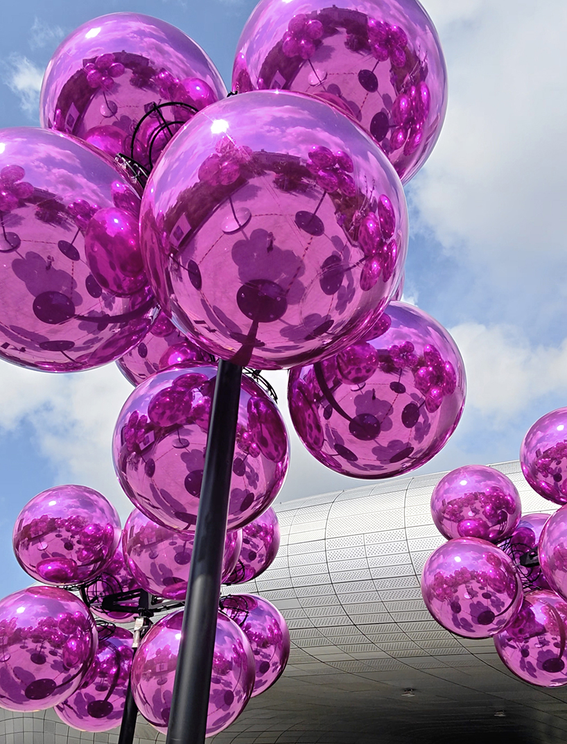 vincent leroy's kinetic cloud sculpture of glossy pink spheres hovers at seoul's design plaza