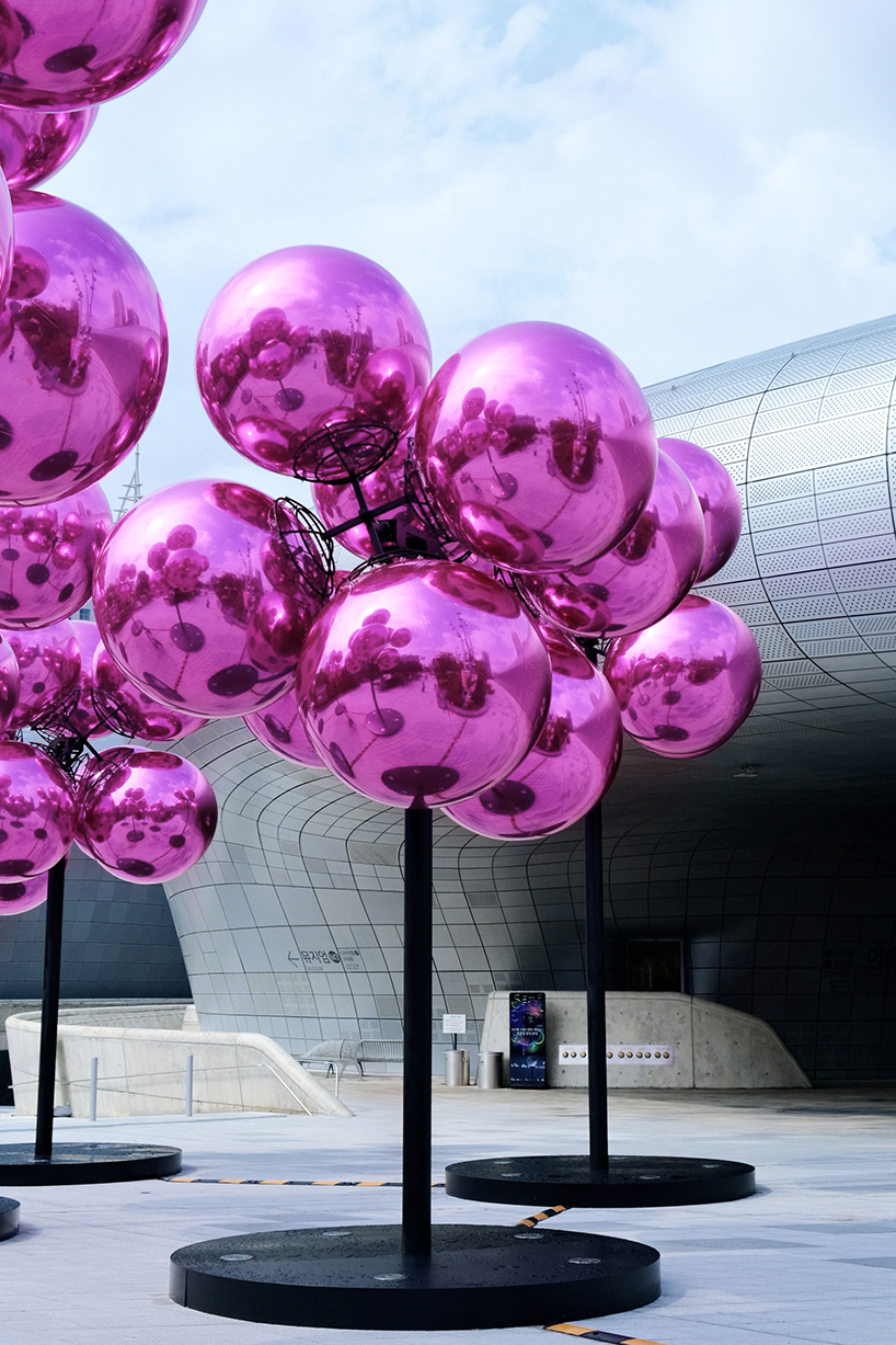 vincent leroy's kinetic cloud sculpture of glossy pink spheres hovers at seoul's design plaza