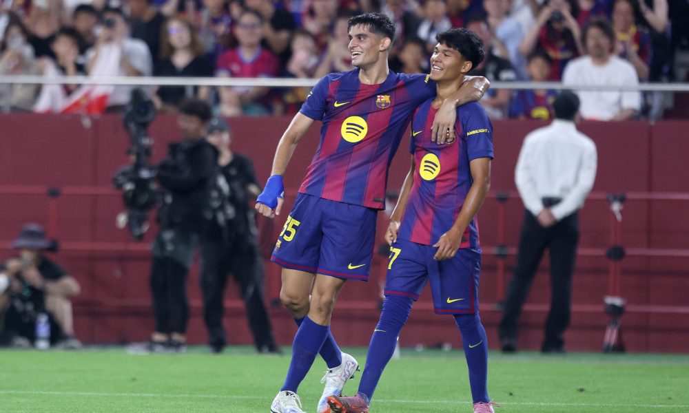 KOBE, JAPAN - JULY 27: FC Barcelona's Pedro Fernandez (R) is congratulated by Gerard Martin during the preseason friendly between Vissel Kobe and FC Barcelona at Noevir Stadium Kobe on July 27, 2025 in Kobe, Hyogo, Japan. (Photo by Paul Miller/Getty Images)