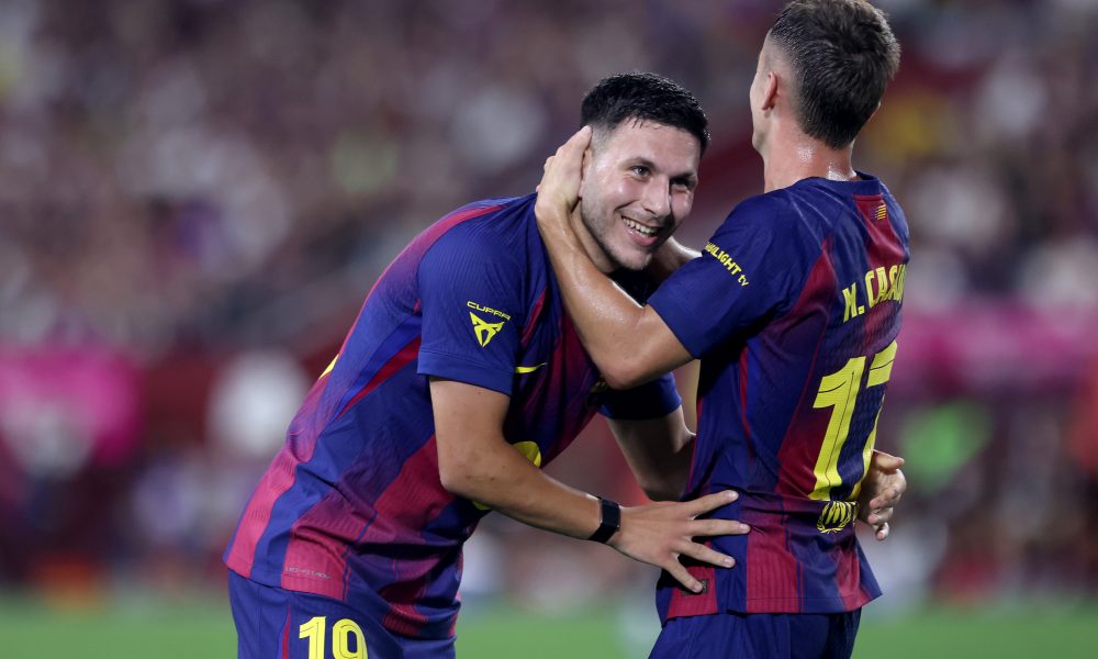 KOBE, JAPAN - JULY 27: FC Barcelona's Roony Bardghji (L) is congratulated by Marc Casado after scoring a goal during the preseason friendly between Vissel Kobe and FC Barcelona at Noevir Stadium Kobe on July 27, 2025 in Kobe, Hyogo, Japan. (Photo by Paul Miller/Getty Images)