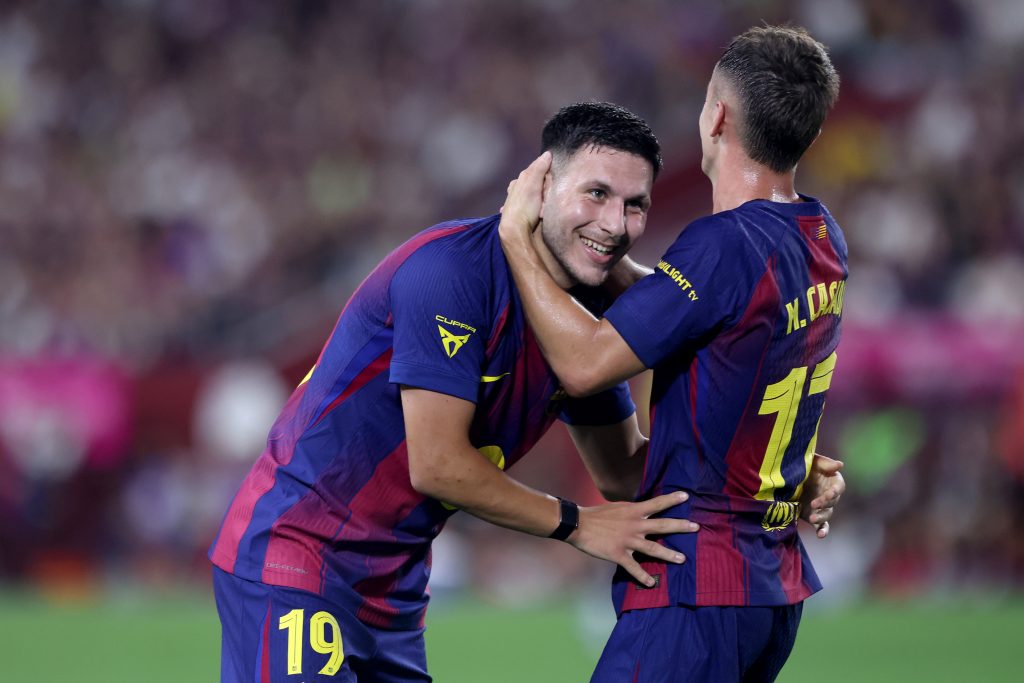 KOBE, JAPAN - JULY 27: FC Barcelona's Roony Bardghji (L) is congratulated by Marc Casado after scoring a goal during the preseason friendly between Vissel Kobe and FC Barcelona at Noevir Stadium Kobe on July 27, 2025 in Kobe, Hyogo, Japan. (Photo by Paul Miller/Getty Images)